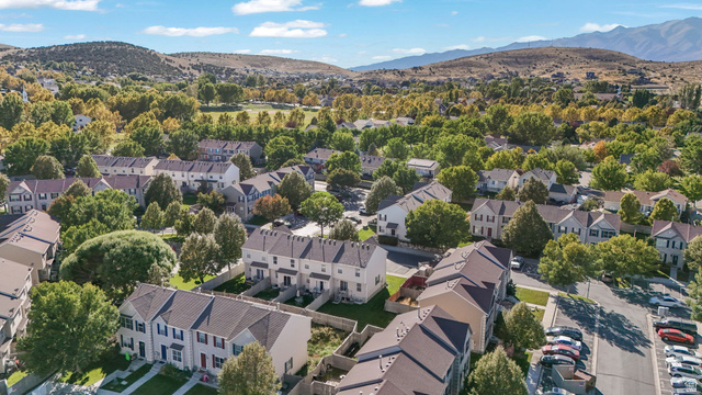 7936 Wycliffe Way Eagle Mountain, UT 84005 - Photo 18 of 37 Aerial view of residential area featuring a mountain backdrop