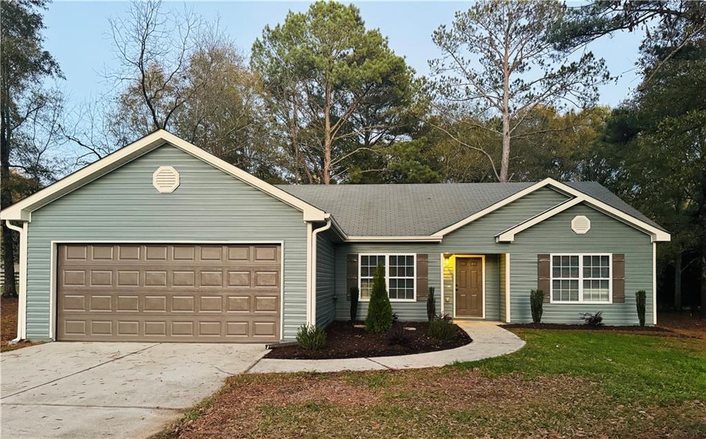 910 Laboon Road Monroe, GA 30655 - Photo 1 of 1 a front view of a house with a yard and garage