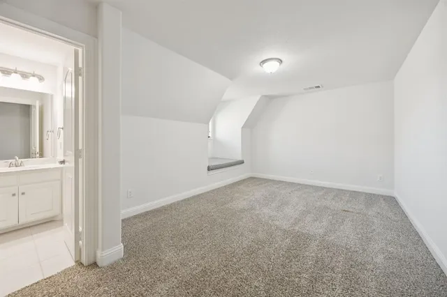 an empty room with a bathroom