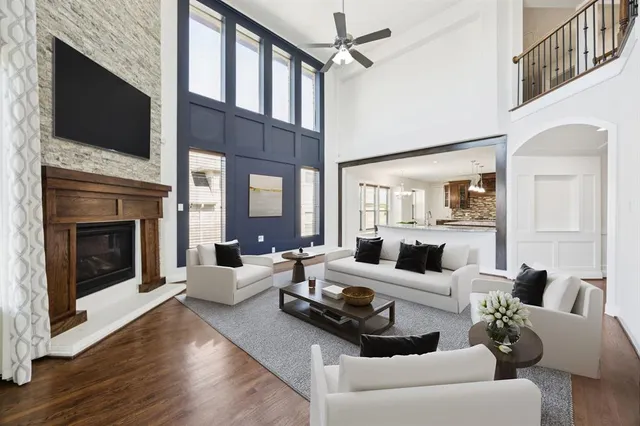 a living room with furniture fireplace and flat screen tv