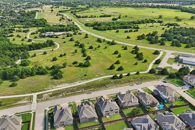 a view of a swimming pool with a yard
