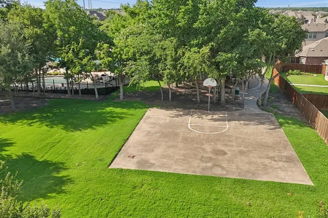 a view of a backyard with swimming pool
