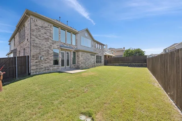 a view of swimming pool with a backyard