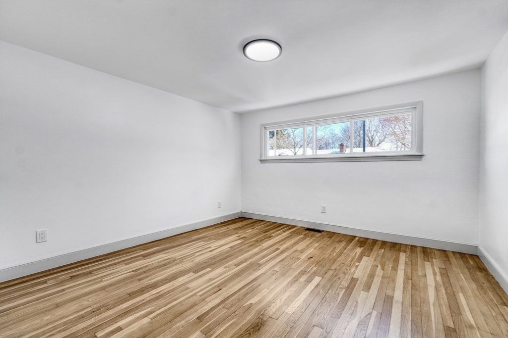 6 Spring Lane Saugus, MA 01906 - Photo 15 of 37 a view of room with window and wooden floor