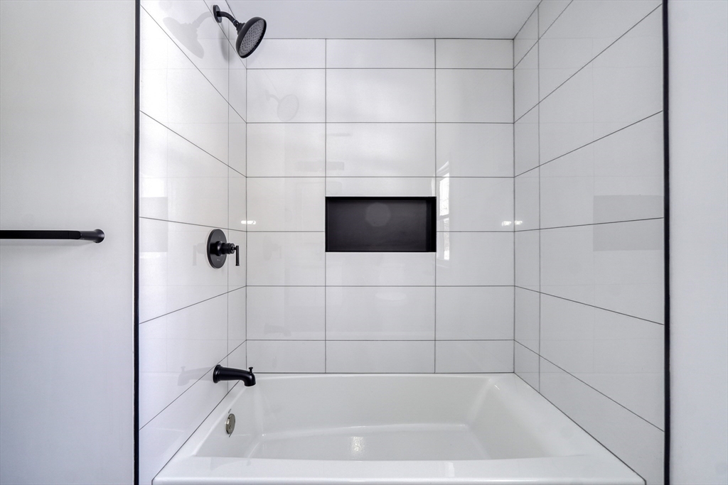 6 Spring Lane Saugus, MA 01906 - Photo 20 of 37 a bathroom with a bathtub