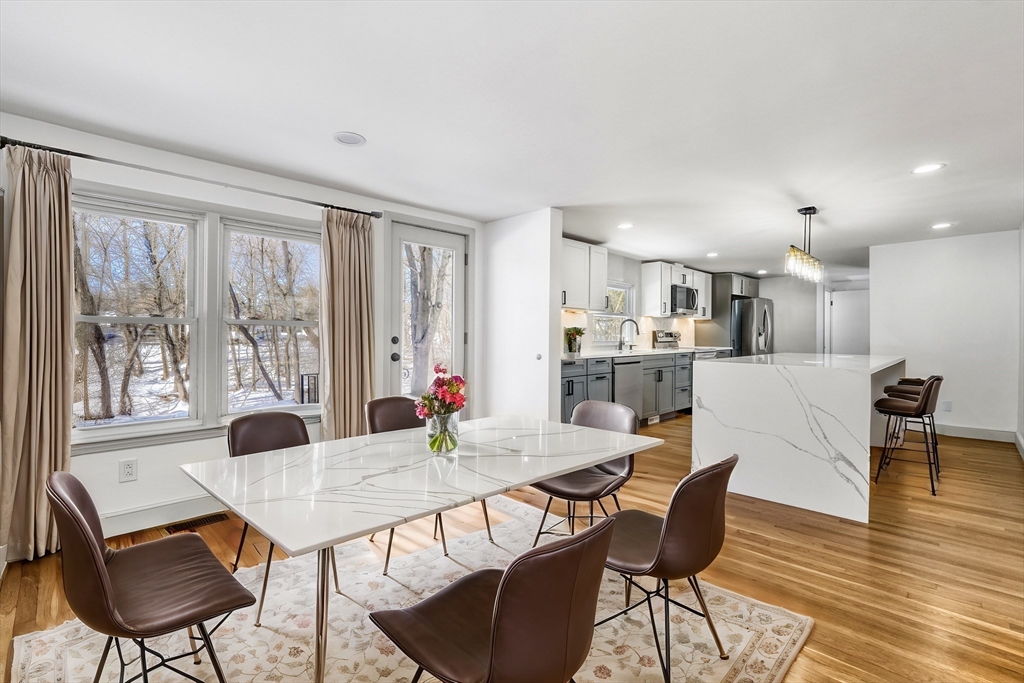 6 Spring Lane Saugus, MA 01906 - Photo 2 of 37 a view of a dining room with furniture and wooden floor