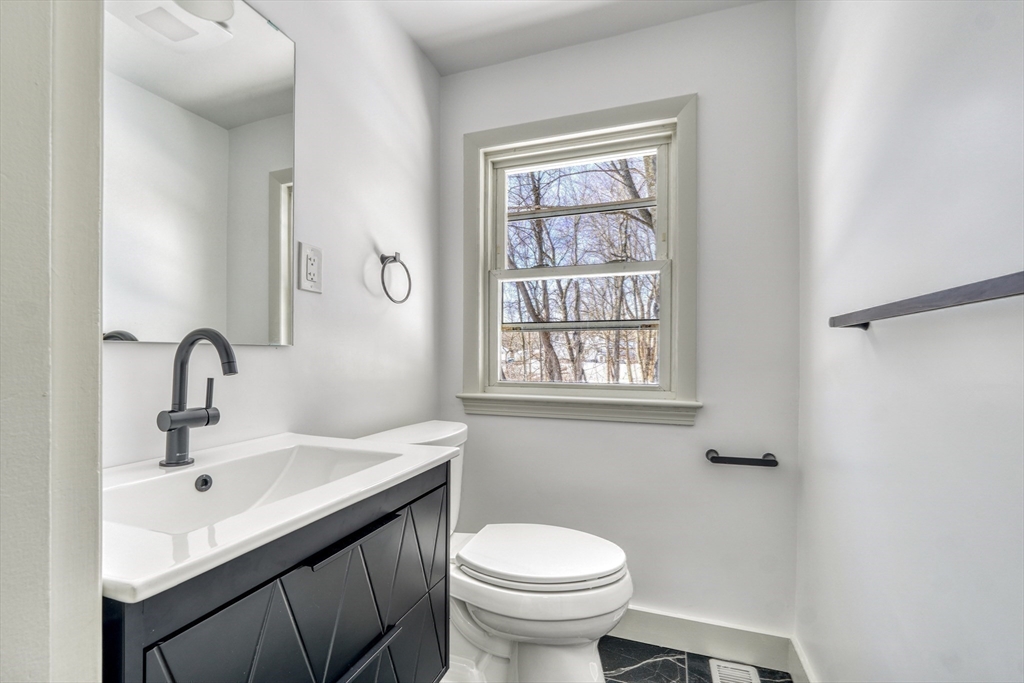 6 Spring Lane Saugus, MA 01906 - Photo 21 of 37 a bathroom with a sink toilet and a window
