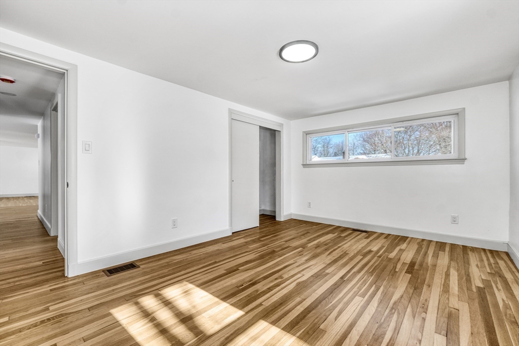 6 Spring Lane Saugus, MA 01906 - Photo 22 of 37 a view of empty room with wooden floor