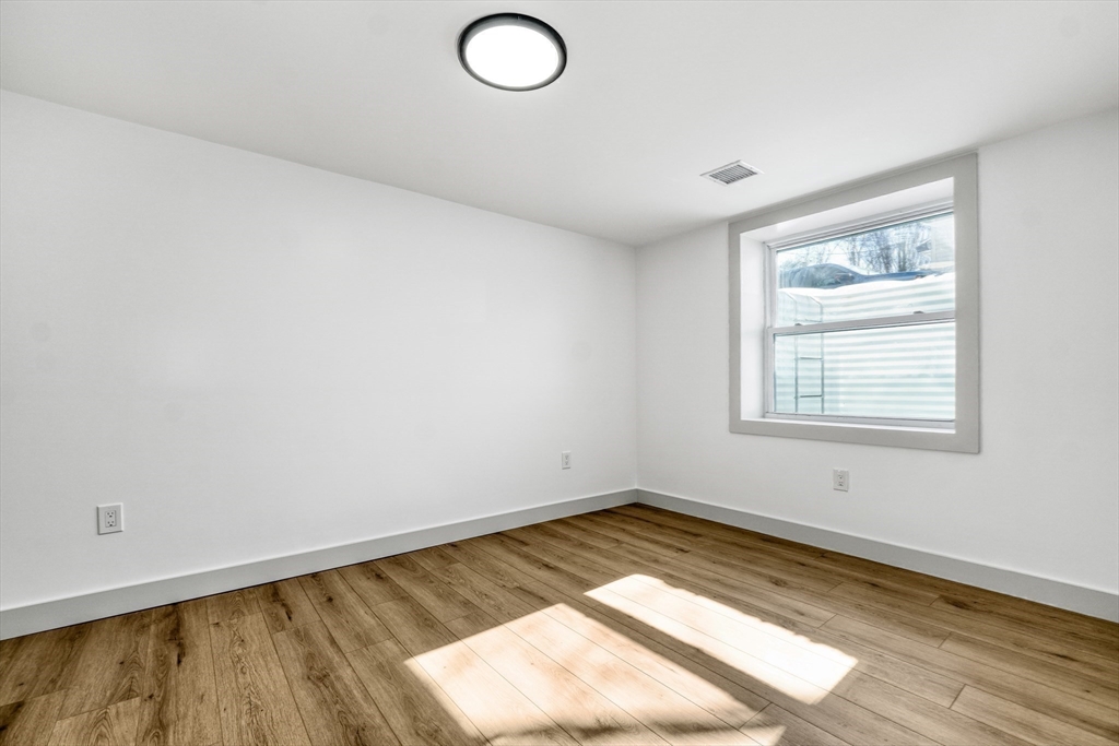6 Spring Lane Saugus, MA 01906 - Photo 27 of 37 a view of a room with wooden floor and window