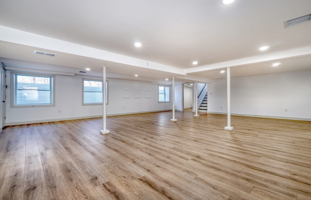 6 Spring Lane Saugus, MA 01906 - Photo 30 of 37 a view of empty room with wooden floor and fan