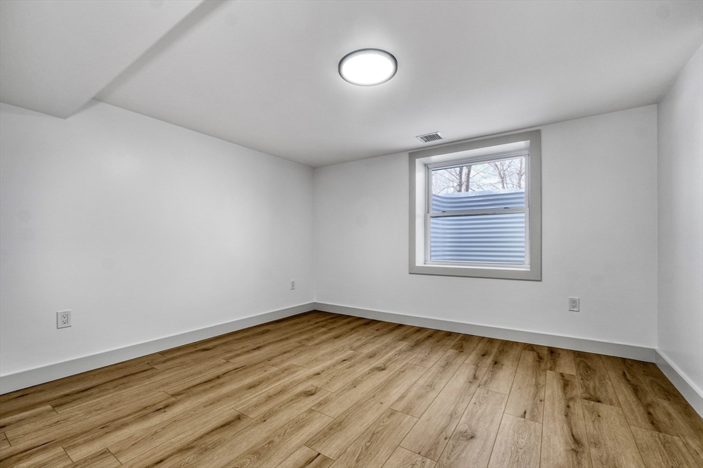 6 Spring Lane Saugus, MA 01906 - Photo 31 of 37 a view of a room with wooden floor and window