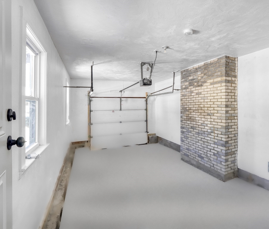 6 Spring Lane Saugus, MA 01906 - Photo 37 of 37 a view of a room with racks on the wall