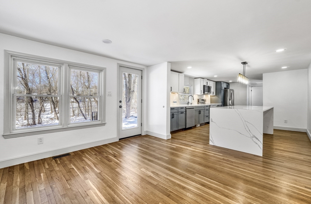 6 Spring Lane Saugus, MA 01906 - Photo 6 of 37 a view of kitchen with wooden floor and electronic appliances