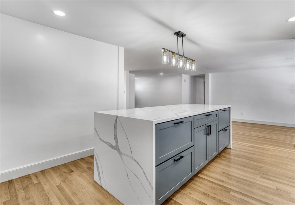 6 Spring Lane Saugus, MA 01906 - Photo 8 of 37 a bathroom with a sink and a mirror