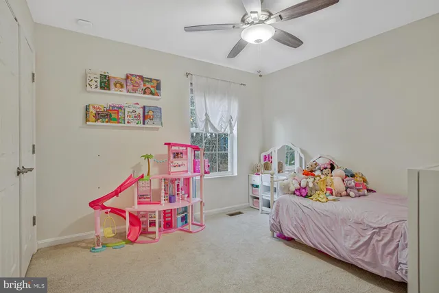 a bedroom with furniture and a chandelier