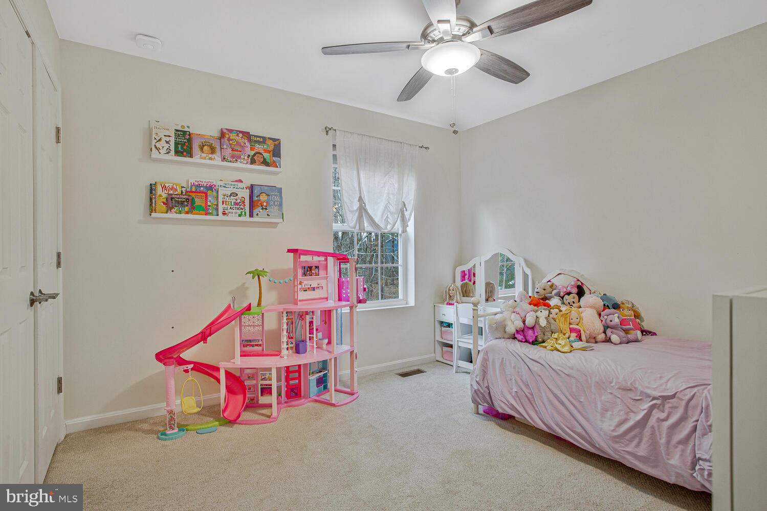 703 Trapper Way Deale, MD 20751 - Photo 11 of 18 a bedroom with furniture and a chandelier