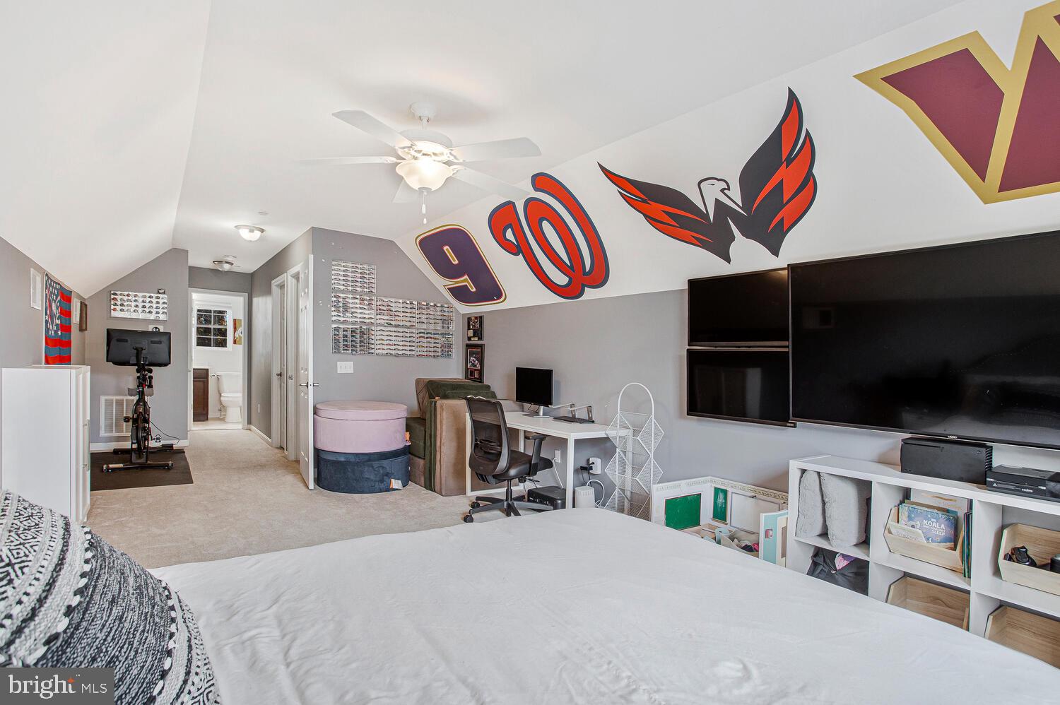 703 Trapper Way Deale, MD 20751 - Photo 16 of 18 a bedroom with furniture and a flat screen tv