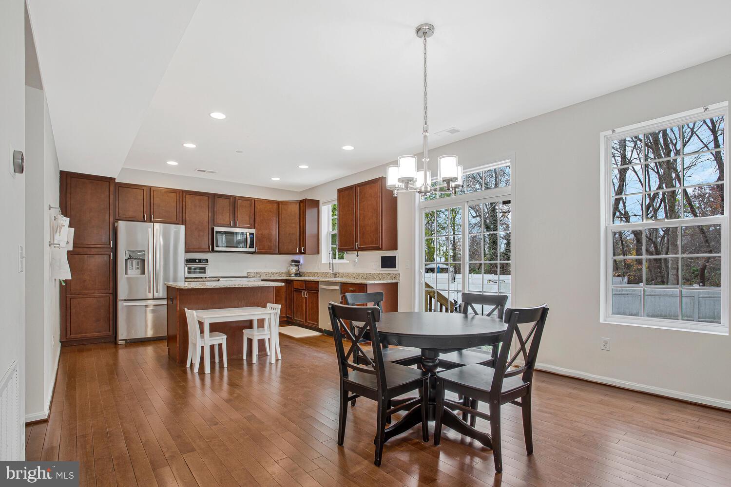 703 Trapper Way Deale, MD 20751 - Photo 4 of 18 a view of a dining room with furniture window and wooden floor