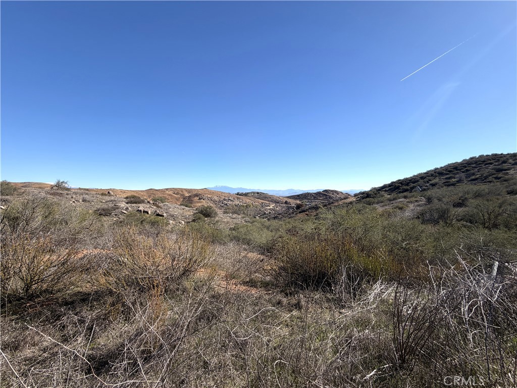 0 Blue Sky Road Perris, CA 92570 - Photo 5 of 14 a view of a mountain range with trees in the background