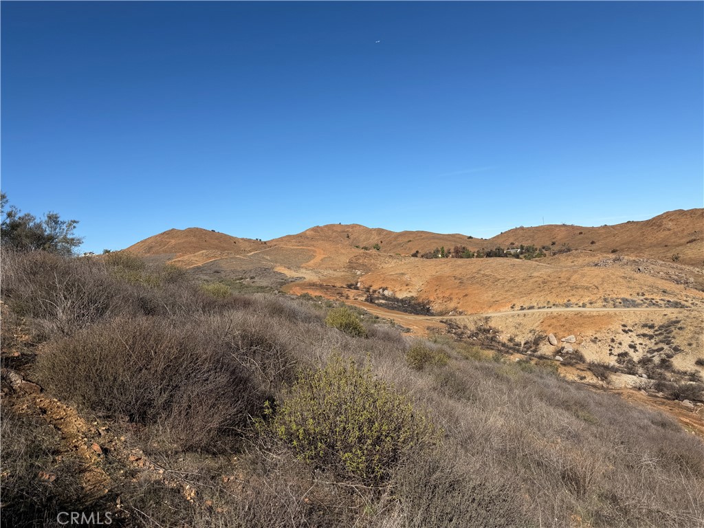 0 Blue Sky Road Perris, CA 92570 - Photo 6 of 14 a view of a mountain range in a cloudy sky