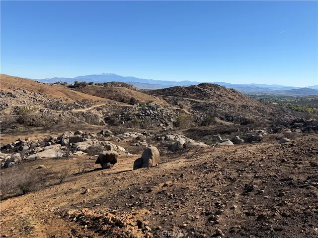a view of a city with mountains in the background