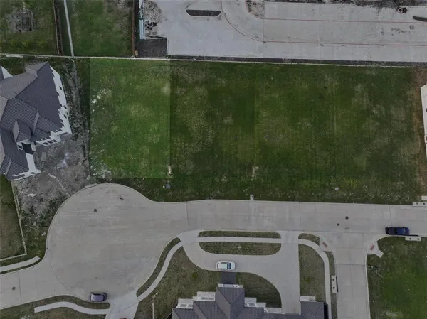 a aerial view of a house with a yard
