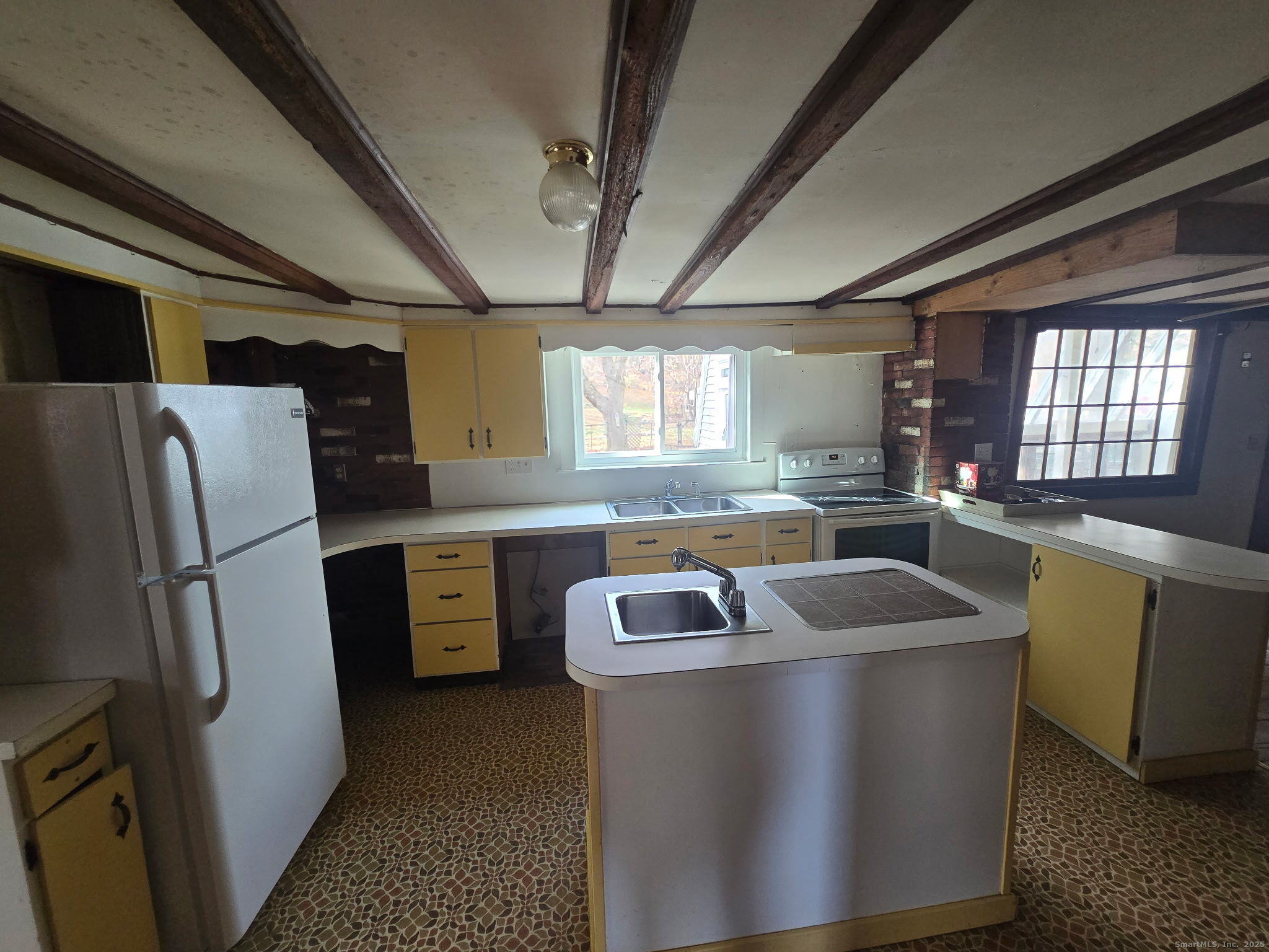 363 Windham Road Windham, CT 06226 - Photo 12 of 28 a kitchen that has a sink and a refrigerator