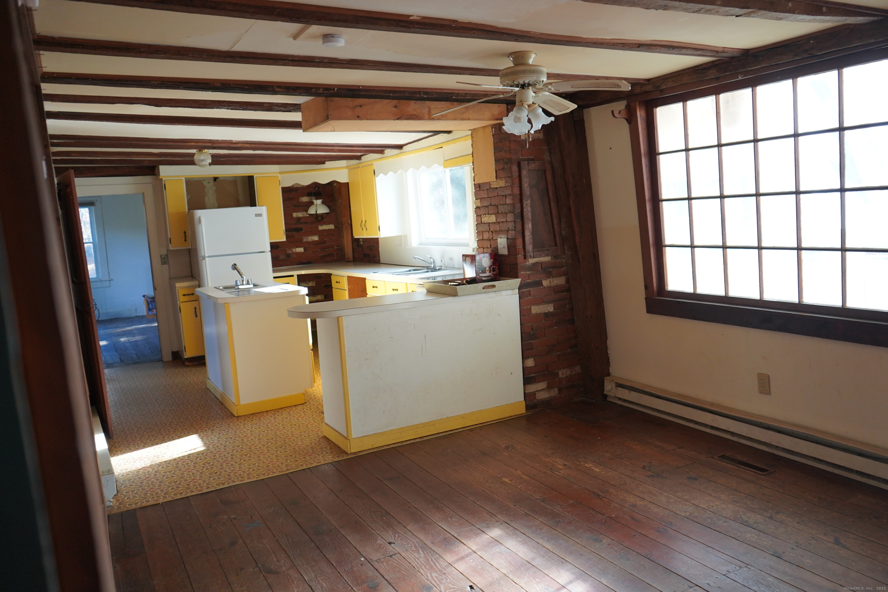 363 Windham Road Windham, CT 06226 - Photo 13 of 28 a view of a kitchen with wooden floor and electronic appliances