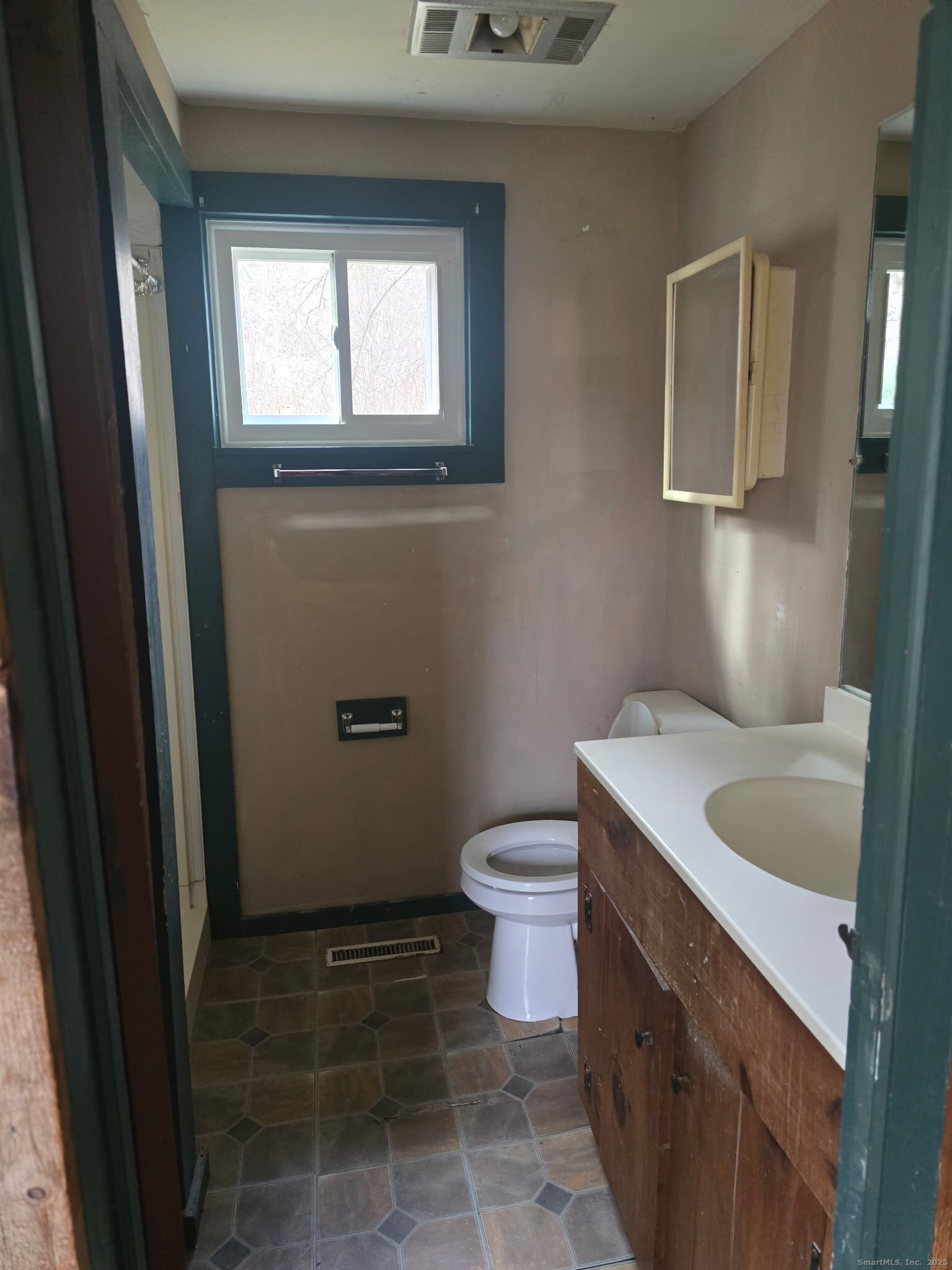 363 Windham Road Windham, CT 06226 - Photo 22 of 28 a bathroom with a granite countertop toilet and a sink