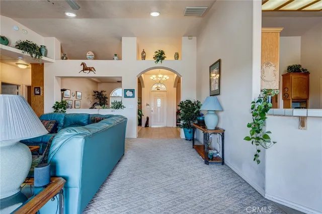 a dining room with furniture and a kitchen view