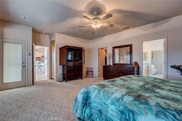 a living room with furniture gym equipment and a chandelier
