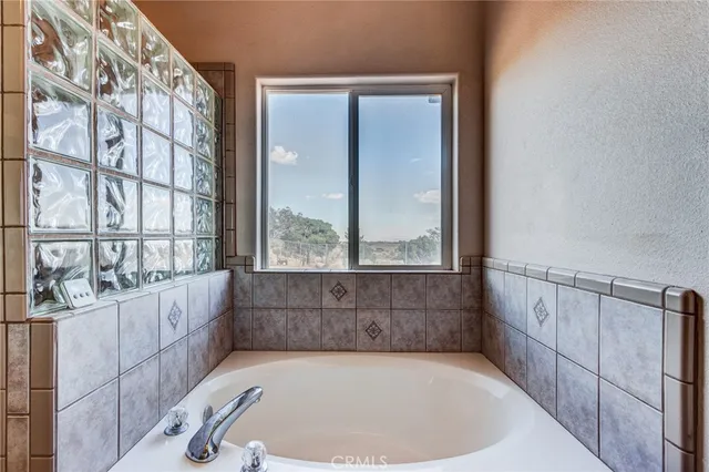 a living room with furniture and a walk in closet