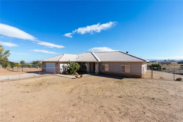 a dining room with furniture and chandelier