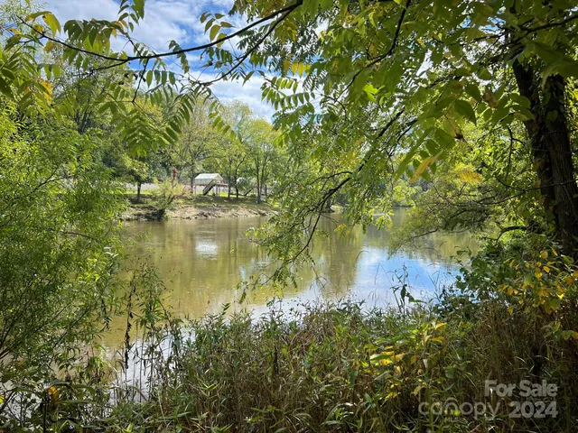 a backyard of a house with lots of green space and fog