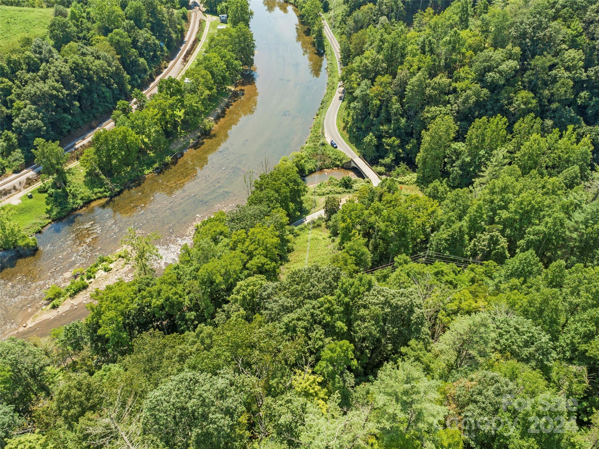 1471 Toe River Road Green Mountain, NC 28740 - Photo 39 of 44 an aerial view of residential house with outdoor space and trees all around