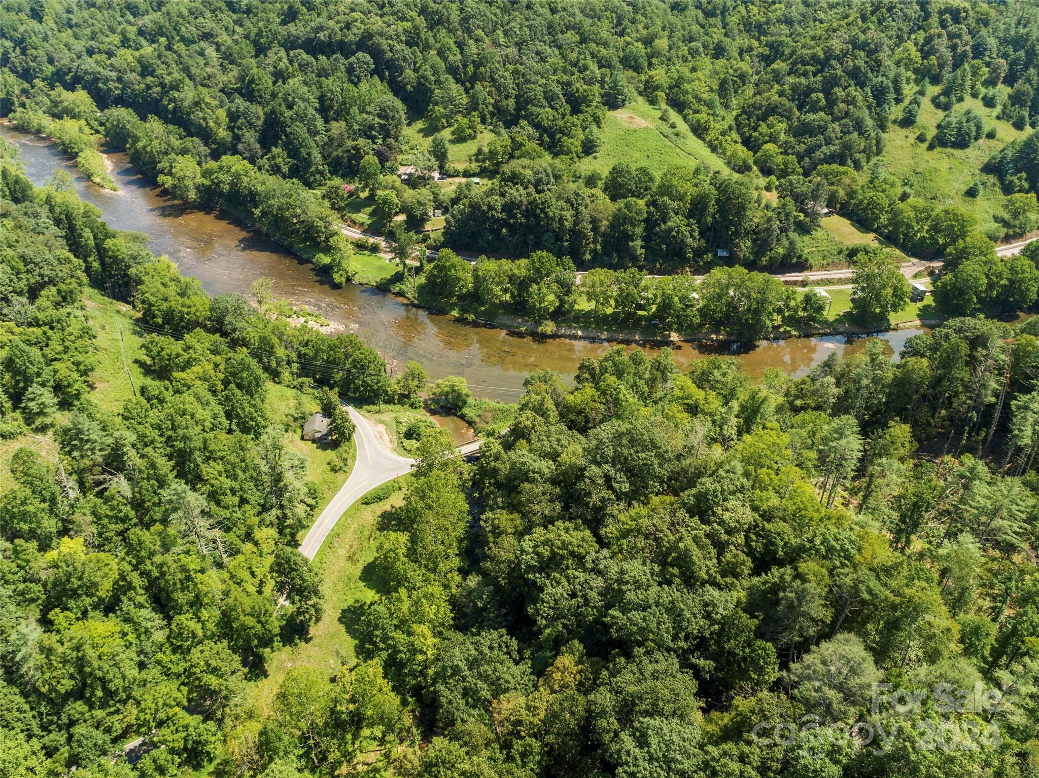 1471 Toe River Road Green Mountain, NC 28740 - Photo 40 of 44 an aerial view of a house with a yard