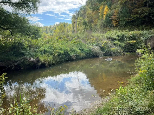 a view of a lake with a yard