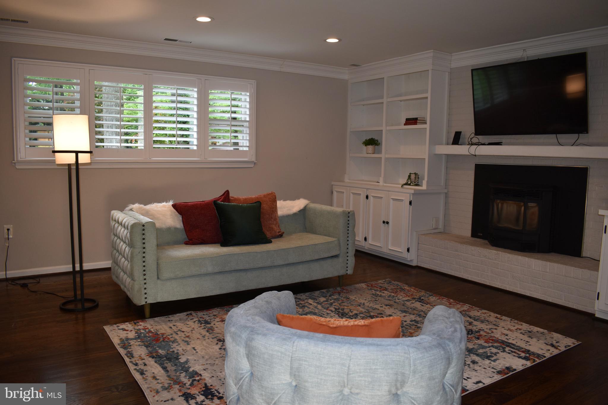 5 Collingwood Garth Phoenix, MD 21131 - Photo 14 of 43 Lower Level Family Room w Pellet Stove