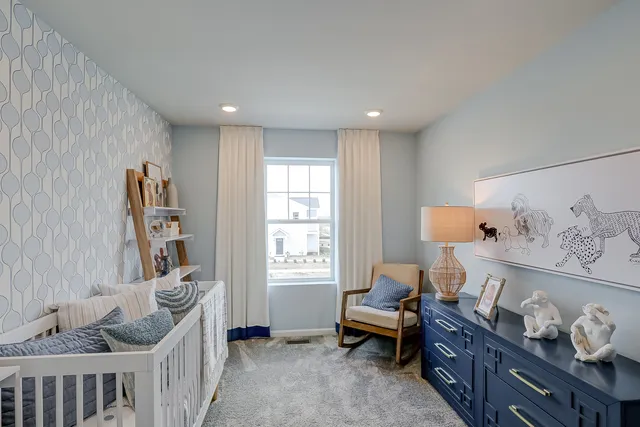 a bed room with furniture and a window