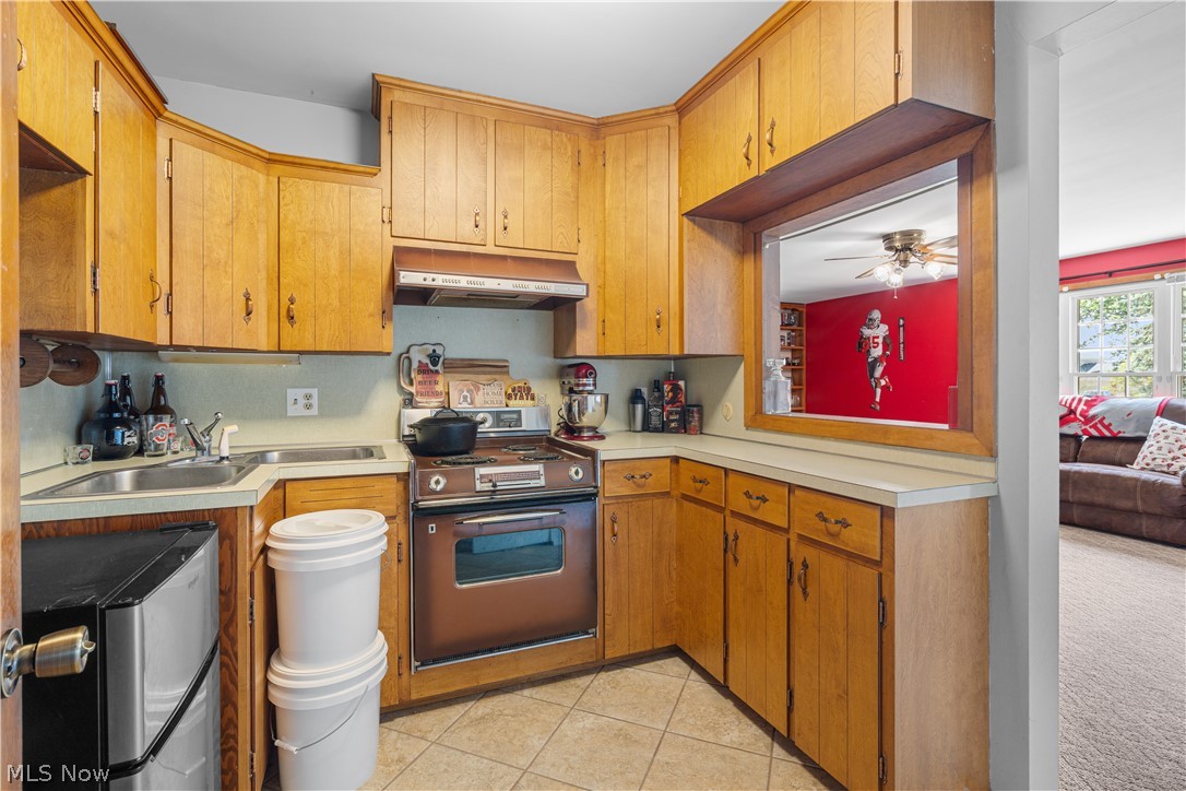 3650 Rambo Avenue Alliance, OH 44601 - Photo 21 of 36 Wood-finish cabinetry and light countertops