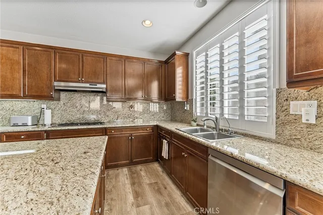 a living room with furniture cabinets and a window
