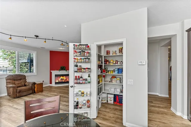 a spacious bedroom with a bed and glass door