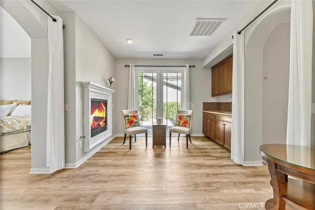 a spacious bedroom with a bed and a fireplace