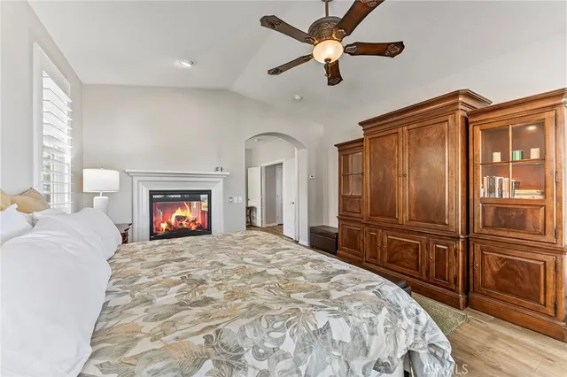 a spacious bathroom with a shower a sink and a mirror