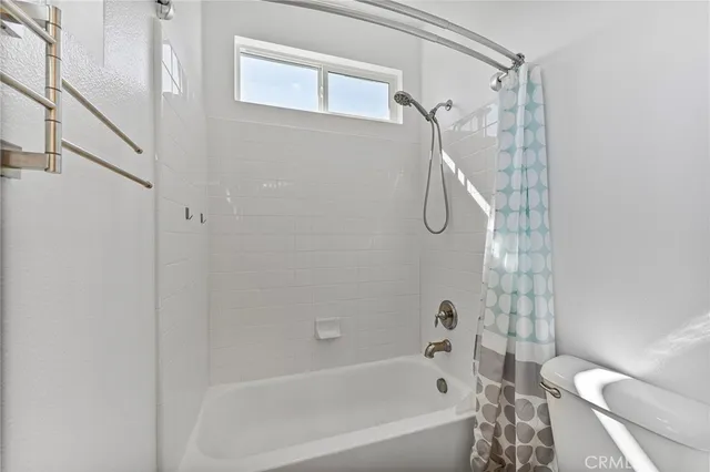 a view of a house with backyard porch and sitting area