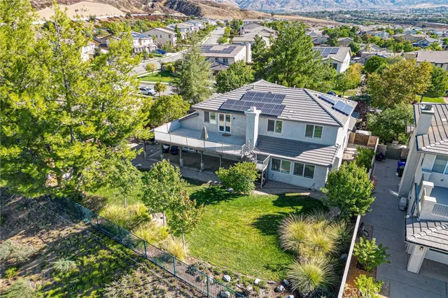 a aerial view of a house with a yard