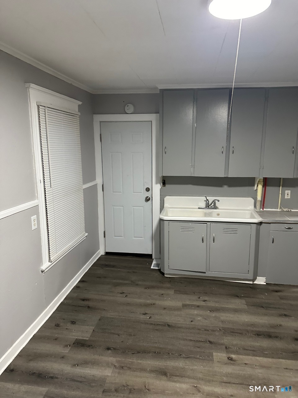 93 Culvert Street Torrington, CT 06790 - Photo 11 of 11 a view of cabinets with wooden floor