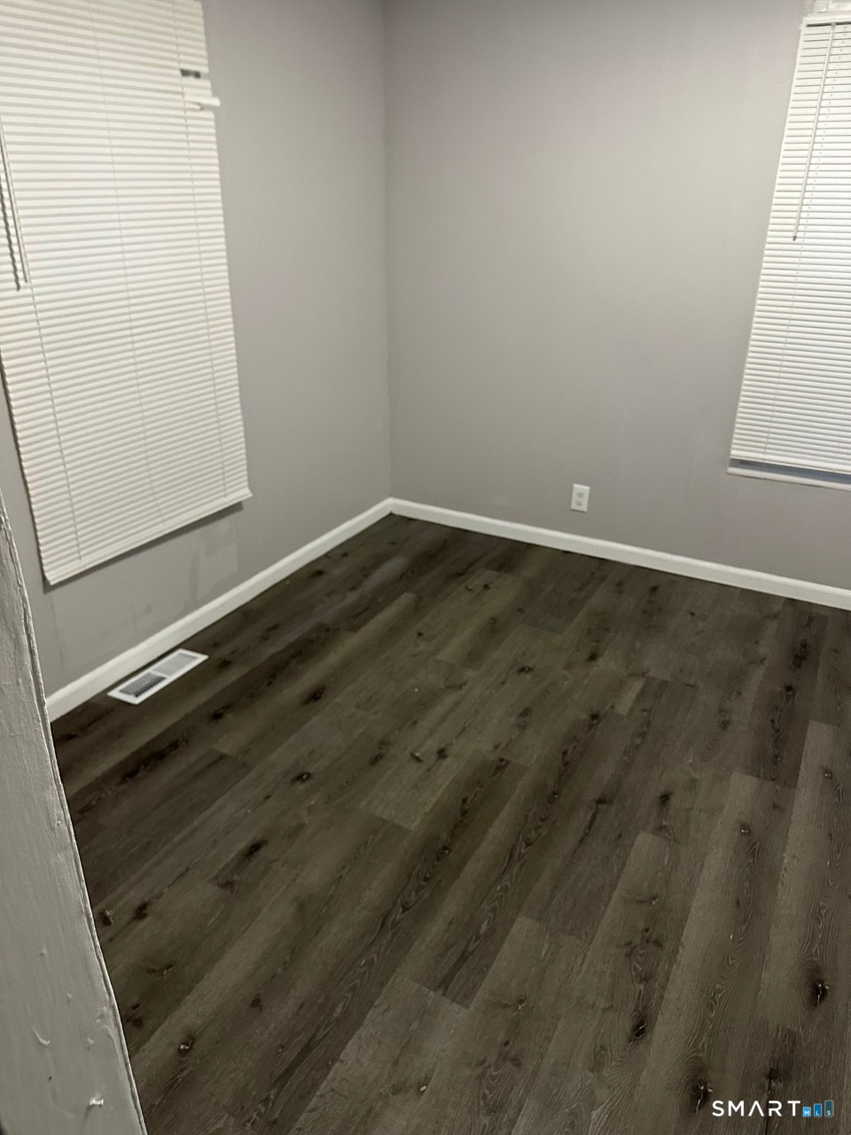 93 Culvert Street Torrington, CT 06790 - Photo 4 of 11 an empty room with wooden floor