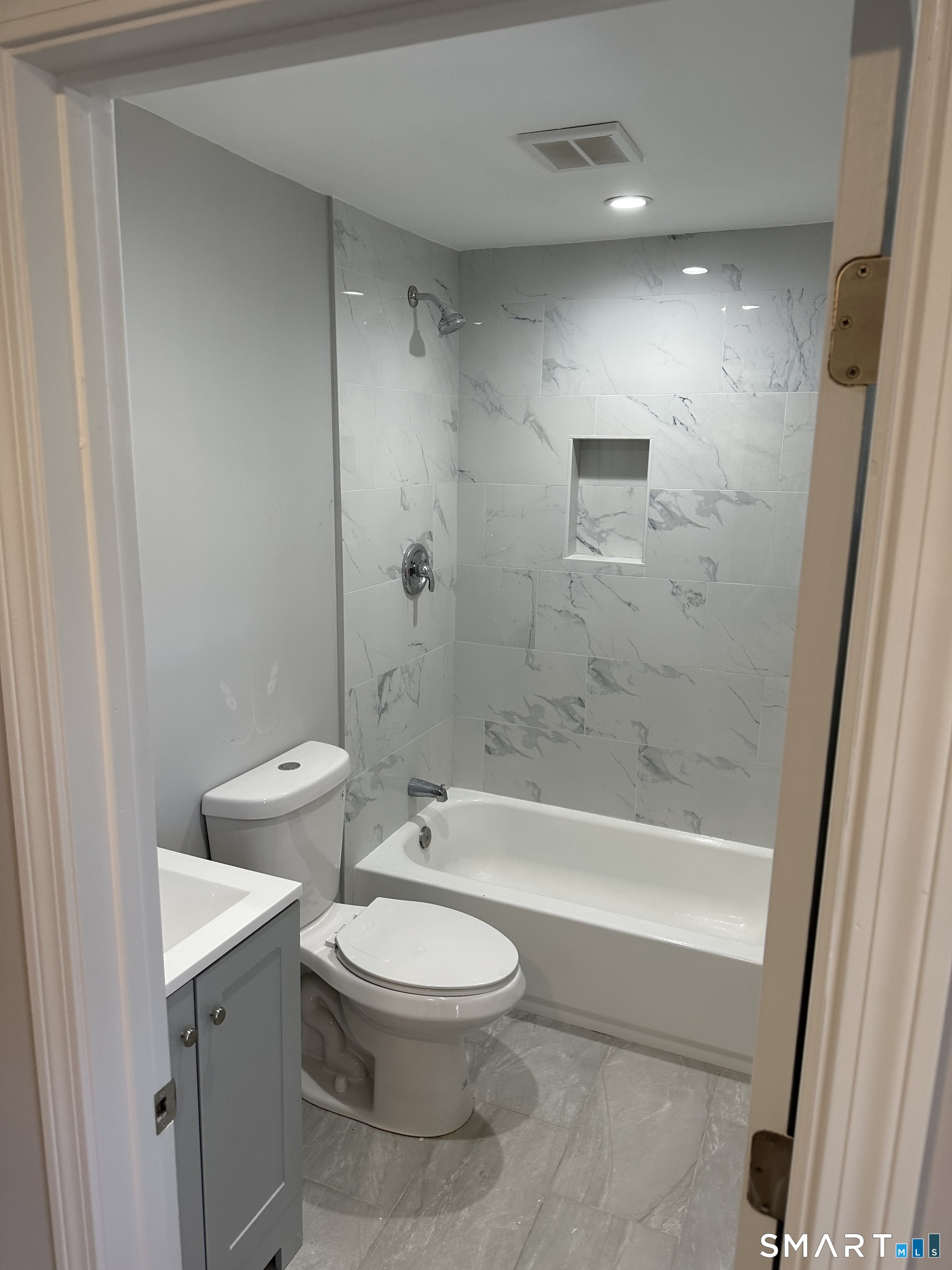 93 Culvert Street Torrington, CT 06790 - Photo 10 of 11 a bathroom with a toilet a sink and bathtub