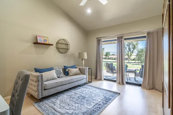 a living room with furniture and a rug